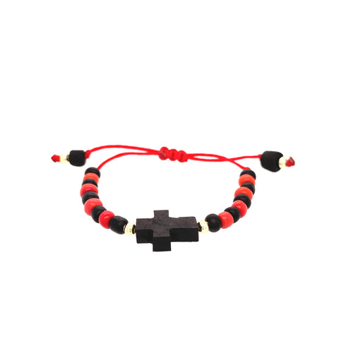 The Genuine Azabache Bracelet for Baby Adjustable Red Rope provides spiritual protection with its vibrant mix of red and black beads and a central black cross-shaped bead. It is elegantly finished with an adjustable red cord and bead accents, making it ideal for those who value both style and meaning.